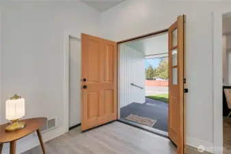 Custom front door, both sides open for easy furniture move-ins, looking onto the covered front porch