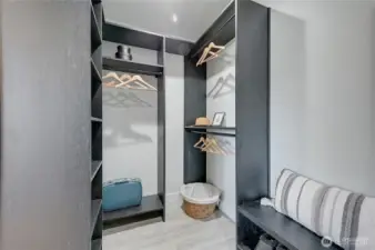 Custom closet for long and short items with sitting bench
