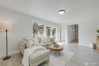 Familyroom doorway on the right leads to a hallway with large storage closet, doorway on left leads to Living room