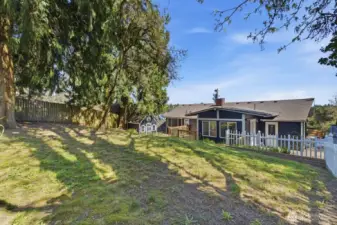 Partially fenced backyard.