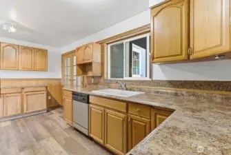 Cozy kitchen with amble counter & cabinet space.