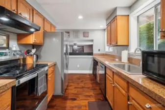 Stainless appliances & wood cabinetry.