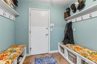 Smartly situated in the house, this mudroom is entered from the garage and around the corner from the front entrance. This room is spacious and has ample room for shoes, coats and much more.