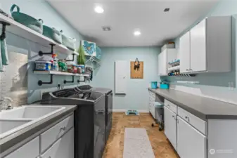 Huge laundry room.  Deep sink and lots of storage including an area for gift wrapping as well as a built-in ironing board.  Also makes a great spot to keep your pet's food.