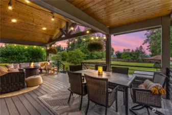 Covered patio with large sitting area and dining space adds to the charm of this home.  With the Washington weather this covered patio makes year round entertaining a dream come true.