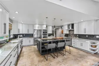 This spacious kitchen has been recently refreshed. Beautiful stainless steal appliances double oven and tons of storage will make this a cooks dream.