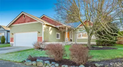 Beautifully landscaped front yard with nice shade in the summer