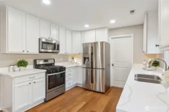 Updated quartz countertops & expansive pantry.