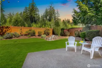 Private, serene backyard with lush landscaping, perfect for relaxing or entertaining.