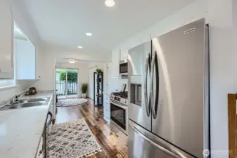 Upgraded french door refrigerator with ice maker. Notice all the cabinet & counter space this kitchen brings!