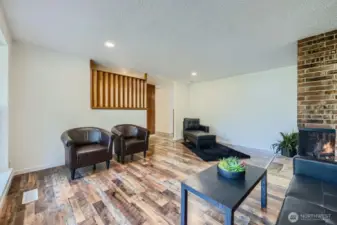 Newly installed, stunning wood tone LVP flooring, updated lighting, freshly painted walls/trim/doors throughout