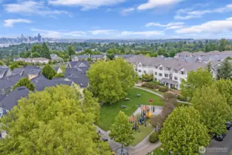 Drone view over the community shows Viewpoint park pond and the close proximity, only 6.5 miles to downtown Seattle. High Point is a sub-neighborhood in West Seattle, within the city of Seattle.