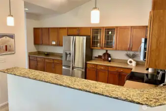 The kitchen is HUGE and features a granite counter eating bar.