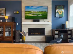 Custom tiled upgraded gas Fireplace with room for any flat screen TV to hang above.