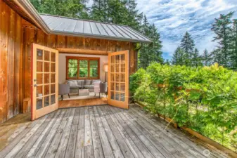 The expansive deck seamlessly connects the home to the surrounding grounds.