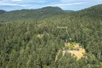 The property is embraced in 6.14 acres of forest lands, creating wonderful privacy and seclusion.