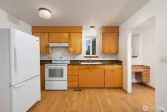 Highly efficient kitchen space. The trim at the top of the cabinets is a nice feature.