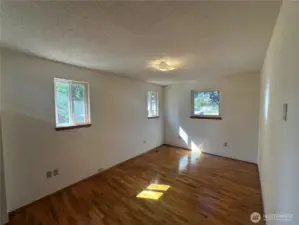 Notice the beautiful hardwood floors in the primary bedroom. It was protected by carpet that has since been pulled up!