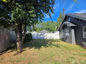 Side yard with fenced back yard