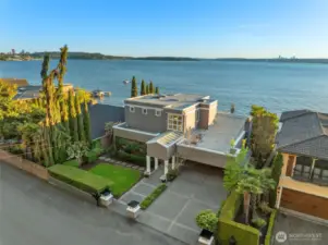 Timeless 3-bed, 3-bath escape where classic charm and lakeside luxury converge - boasting 60 feet of prime, southwest-facing shoreline built to be cherished for generations.