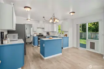 Convenient slider off the kitchen with a doggy door to the secure fenced yard