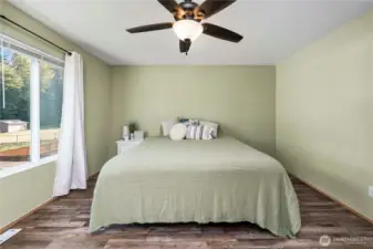Neutral, contemporary paint paired with a sleek ceiling fan for comfort and style