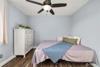 Bedroom Bedroom #3 features contemporary wall colors, a ceiling fan, and durable LVP flooring