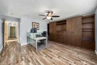 Versatile Bedroom #4 serves as a home office with ample built-in storage and easy-care vinyl plank flooring