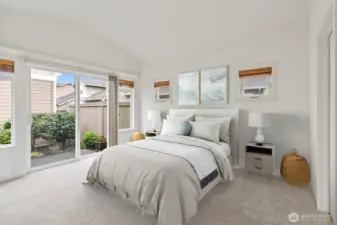 Spacious primary suite with vaulted ceilings.