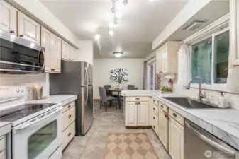 Kitchen towards dining room new refer and dishwasher