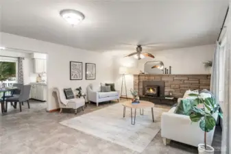 Living Room with fireplace wood stove lots of natural lighting