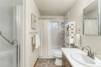 Main bath has tub with shower and separate Walk in Shower.