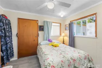 Extra finished room behind garage with 1/2 bath