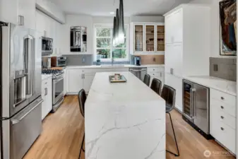 Updated chef's kitchen with quartz waterfall island.  Large pantry!