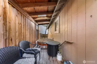Covered porch with drop in hot tub