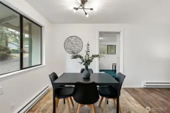 The den or primary bedroom on the opposite side of home from other three bedrooms.