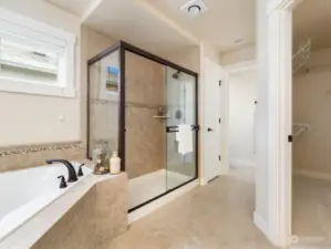 It features a luxurious 5-piece ensuite bath, soaking tub, expansive walk-in closet.