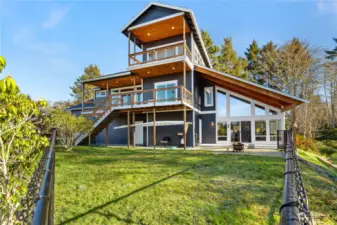 Back of home features over 400 feet of decking and beautiful finished wood ceilings