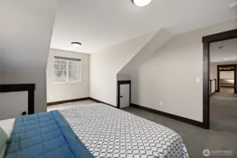 This bedroom also includes an extra storage area, perfect for toys or seasonal items.