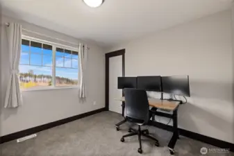 Second upstairs bedroom with generous proportions and natural light.