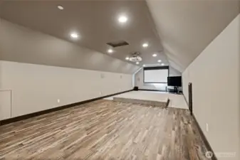 Massive upstairs entertainment area—ideal for a theatre, game room, or both!
