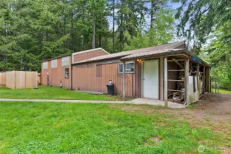 This shop is 1440 sq ft. The fenced area to the far left hides the propane tank and well.