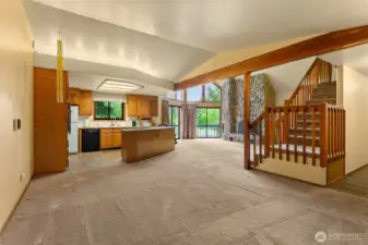 This is the dining area with an open-concept kitchen behind.