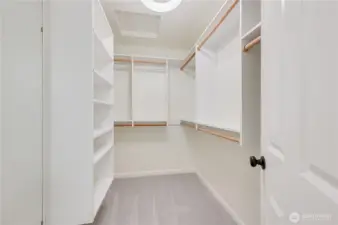 Walk-in closet in primary bathroom