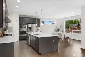 The heart of the home features modern finishes and soaring ceilings, perfect for entertaining