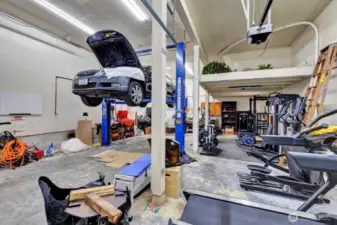 Space for 2-car tandem is currently occupied by fully equipped gym with treadmill, elliptical, free weights, cable machines, squat rack