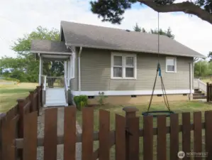 Fully fenced side yard.  Room for more garden here!