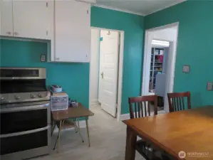 From the kitchen to the full bath.  Side entry and the utility room to the right.