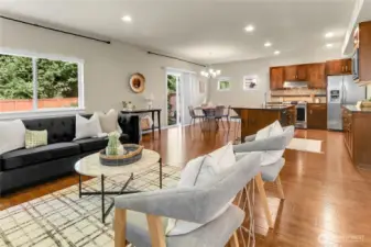 In the kitchen dining area an oversized window overlooks the fully fenced backyard, and two smaller windows overlook the side yard.