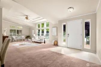 The entryway has tile flooring,side-light windows framing the front door. Natural light pours through tall windows, creating a bright, open atmosphere the moment you step inside.